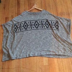 Gray knitted poncho.